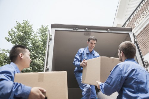 Local moving team working near apartment buildings in Canning Town