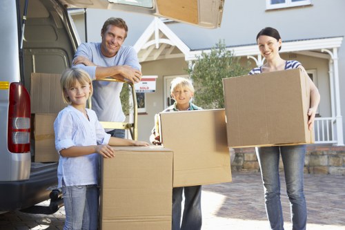 Removal van and packed boxes prepared for a Canning Town home move