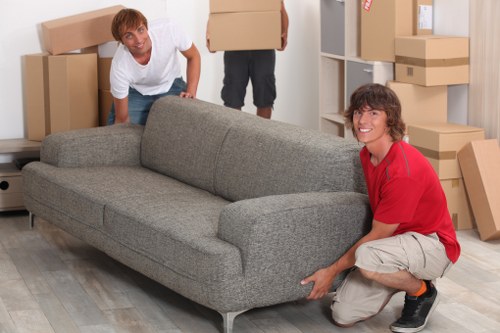 Furniture and boxes being prepared for transport by movers in Canningtown