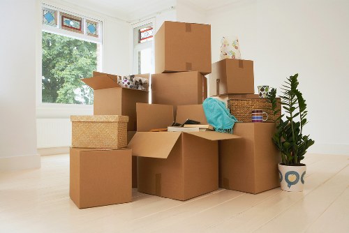 Packing and loading household items into a removal van