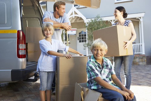 Moving team handling furniture in a Canningtown home relocation