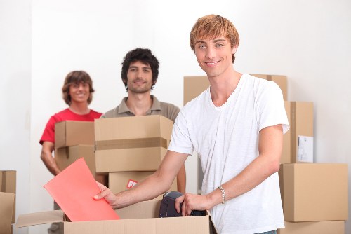 Local van removal team handling furniture transport for a flat move in Canning Town